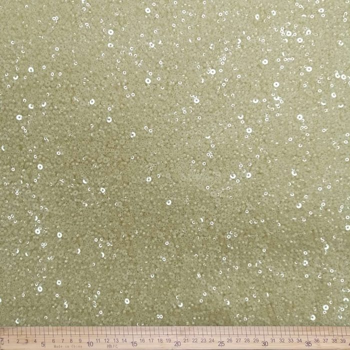 Bridal Glitter MMS165 Nude Ivory – Elegant nude and ivory fabric with a subtle glitter finish, perfect for creating wedding gowns, bridesmaid dresses, and special occasion attire, adding sophistication and glamour.