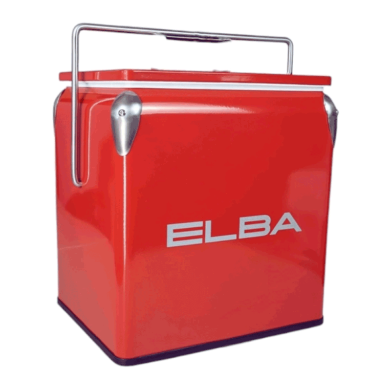 The Elba Retro Metal Cooler Box in vibrant red, with its handle upright, in an outdoor or picnic setting.